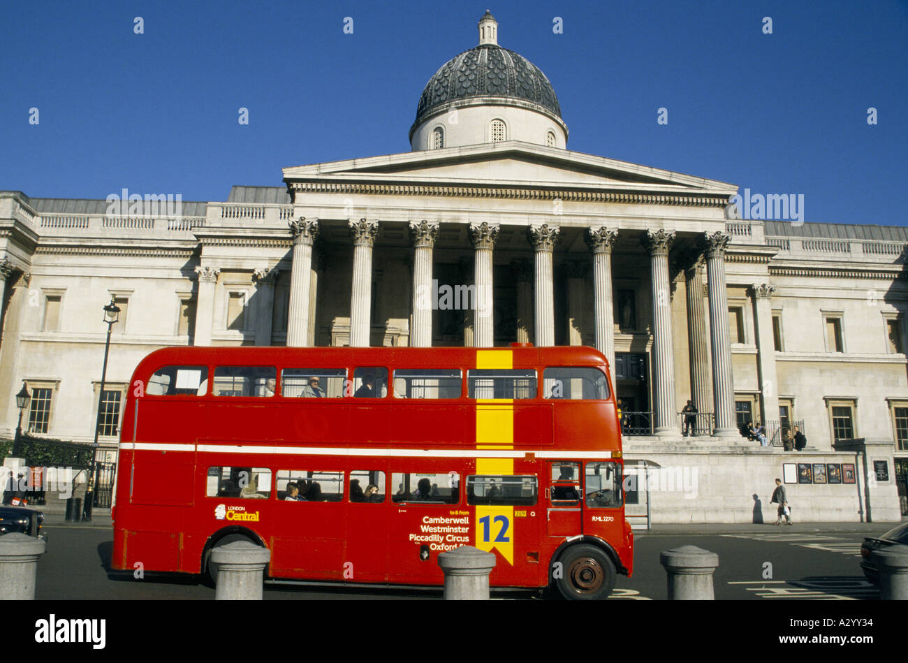 red double decker bus passing in front of the national gallery london 1996 Stock Photo