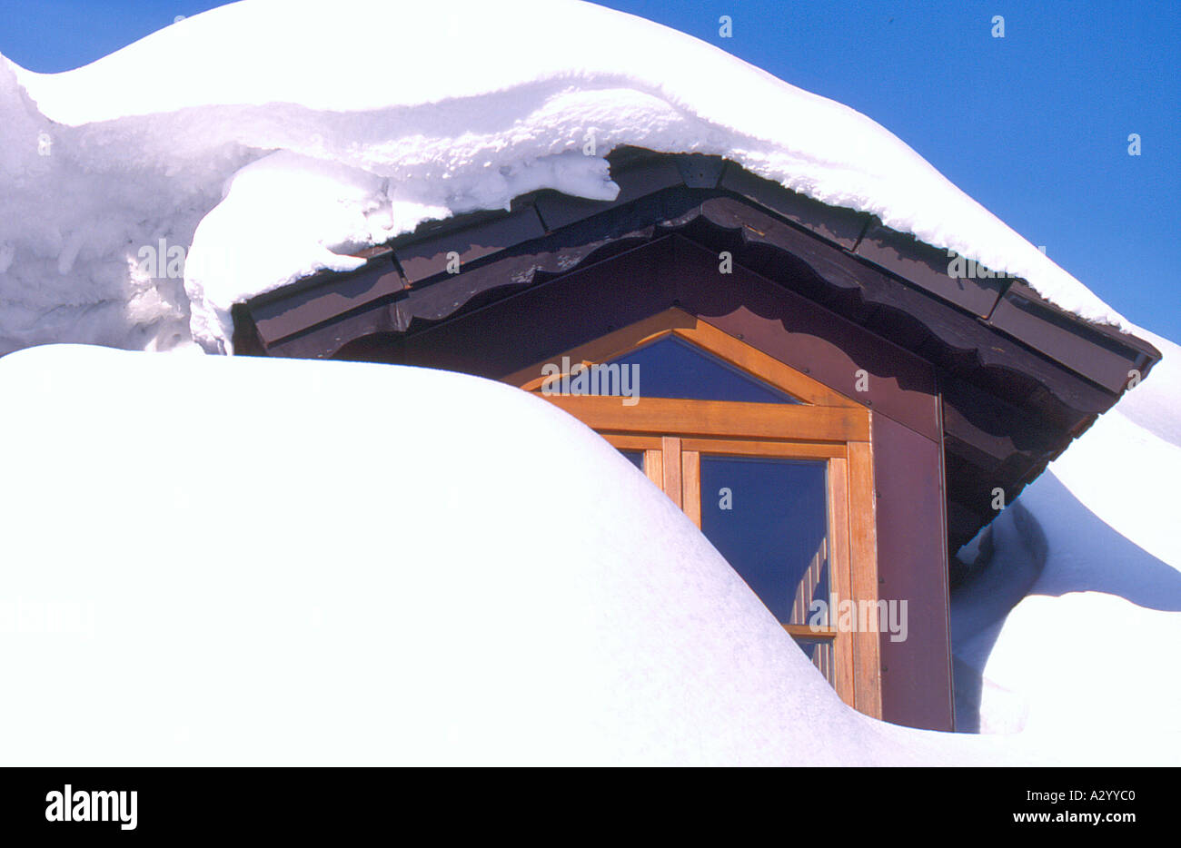 attic window on roof in winter covered by snow. Photo by Willy Matheisl ...