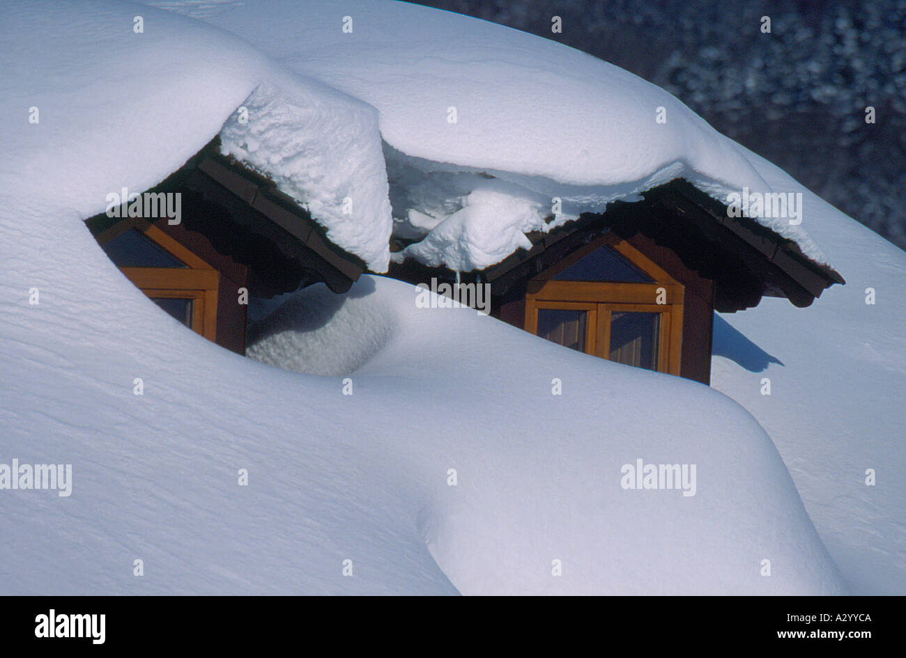 two attic windows on roof of Bavarian House, covered by snow. Photo by Willy Matheisl Stock Photo