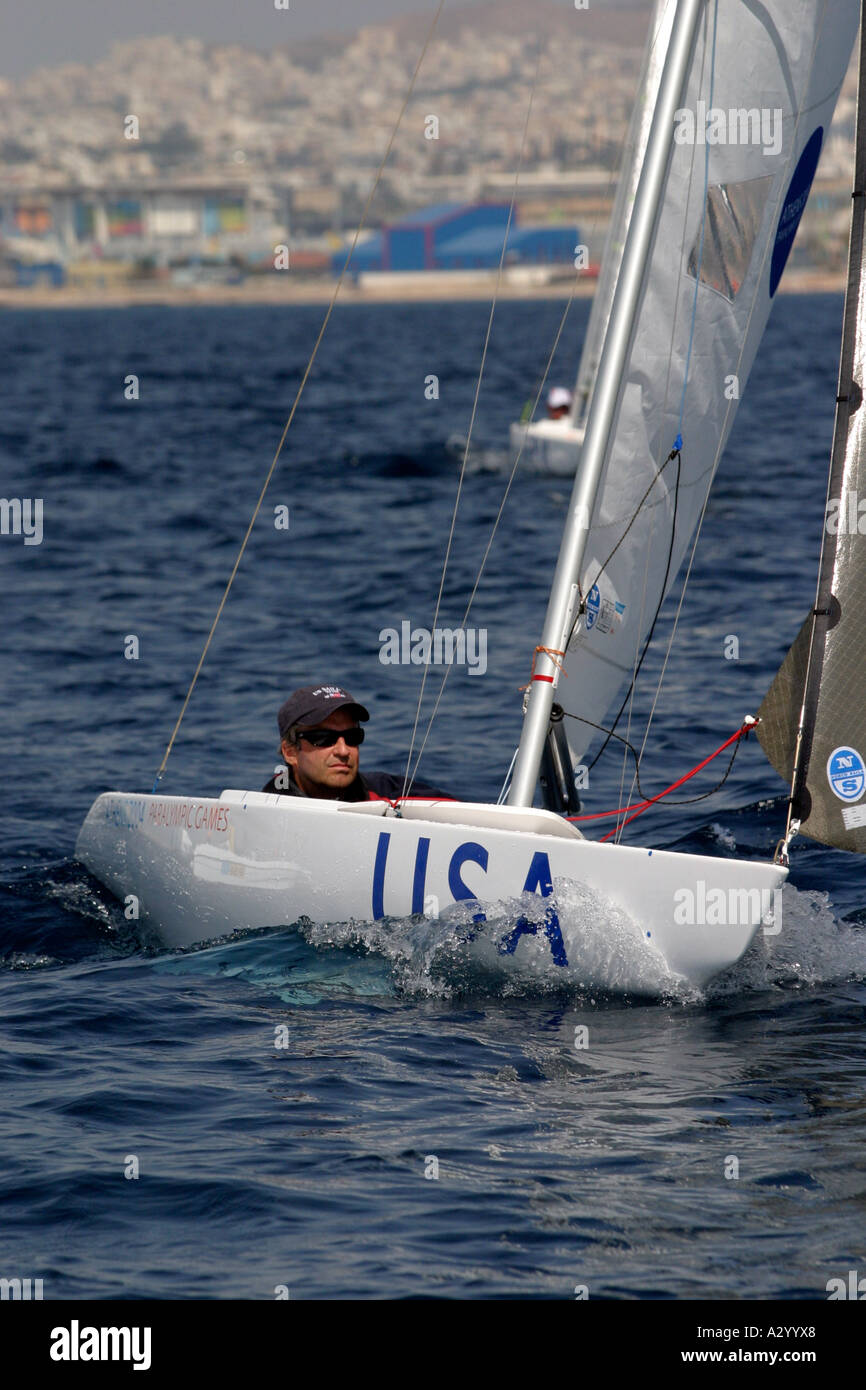 Thomas Brown of the USA competes in race 3 of the Mixed 2 4mR open category during the Athens 2004 Paralympic Games Stock Photo