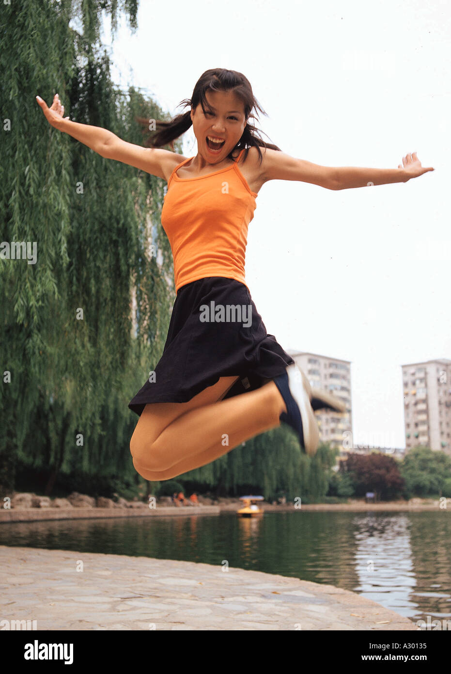 a chinese young woman upspring Stock Photo