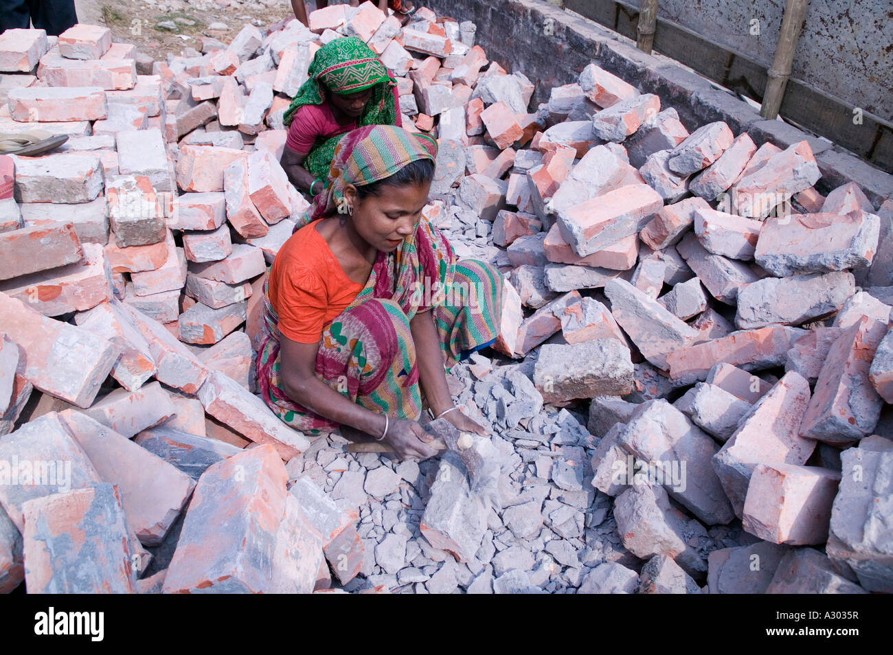 Cleaning bricks of cement pieces Stock Photo