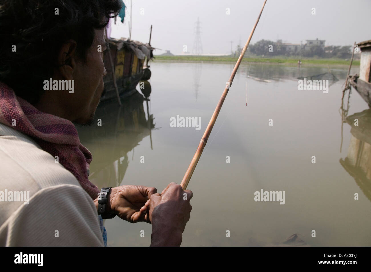 Fishing with simple poles in the river Bangladesh Stock Photo