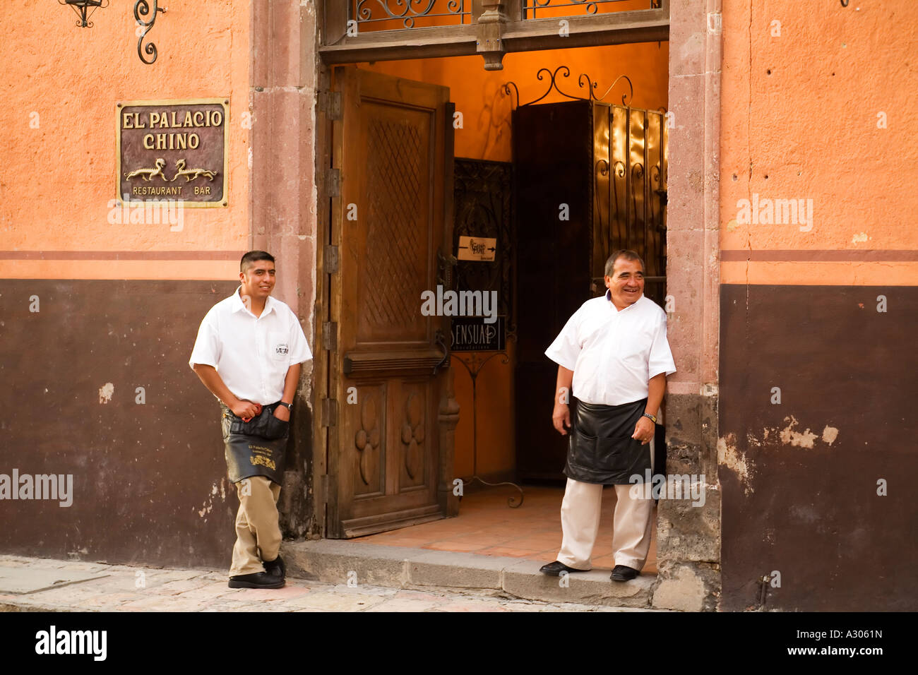 MEXICO San Miguel de Allende Two adult male restaurant workers stand in