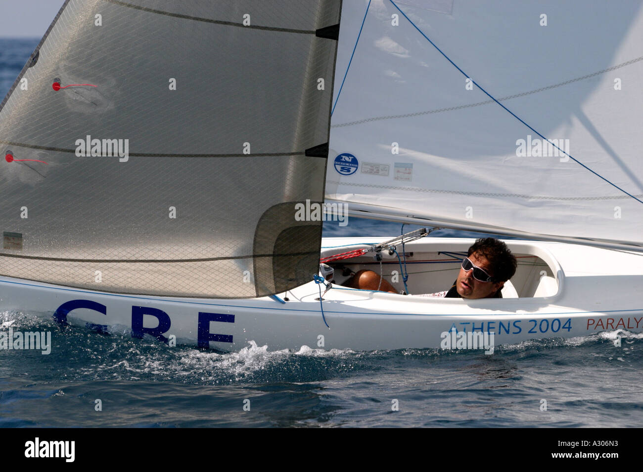 Stamatis Kalligeris of Greece competes in race 7 of the Mixed 2 4mR open category during the Athens 2004 Paralympic Games Stock Photo