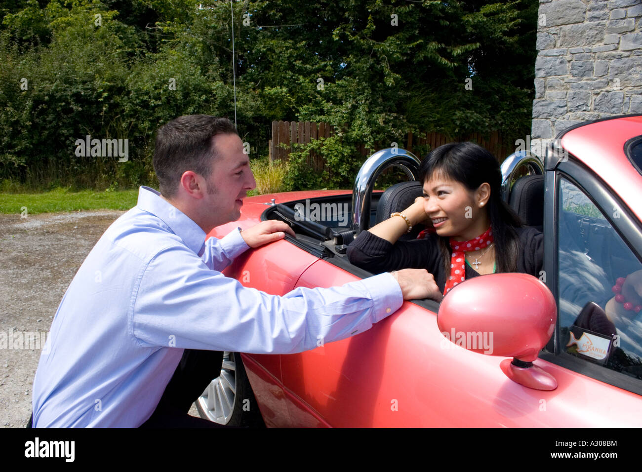 Chinese woman and caucasian man smiling Stock Photo