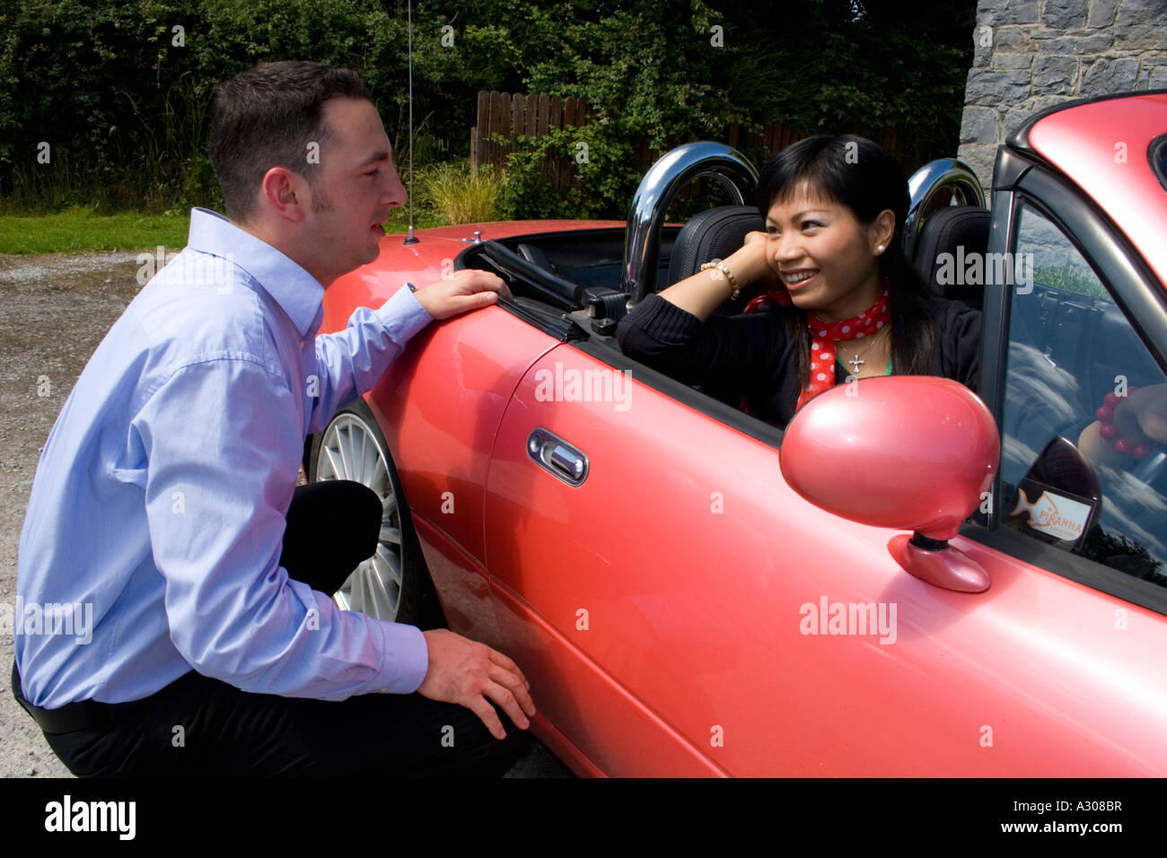 Chinese woman and caucasian man talking Stock Photo