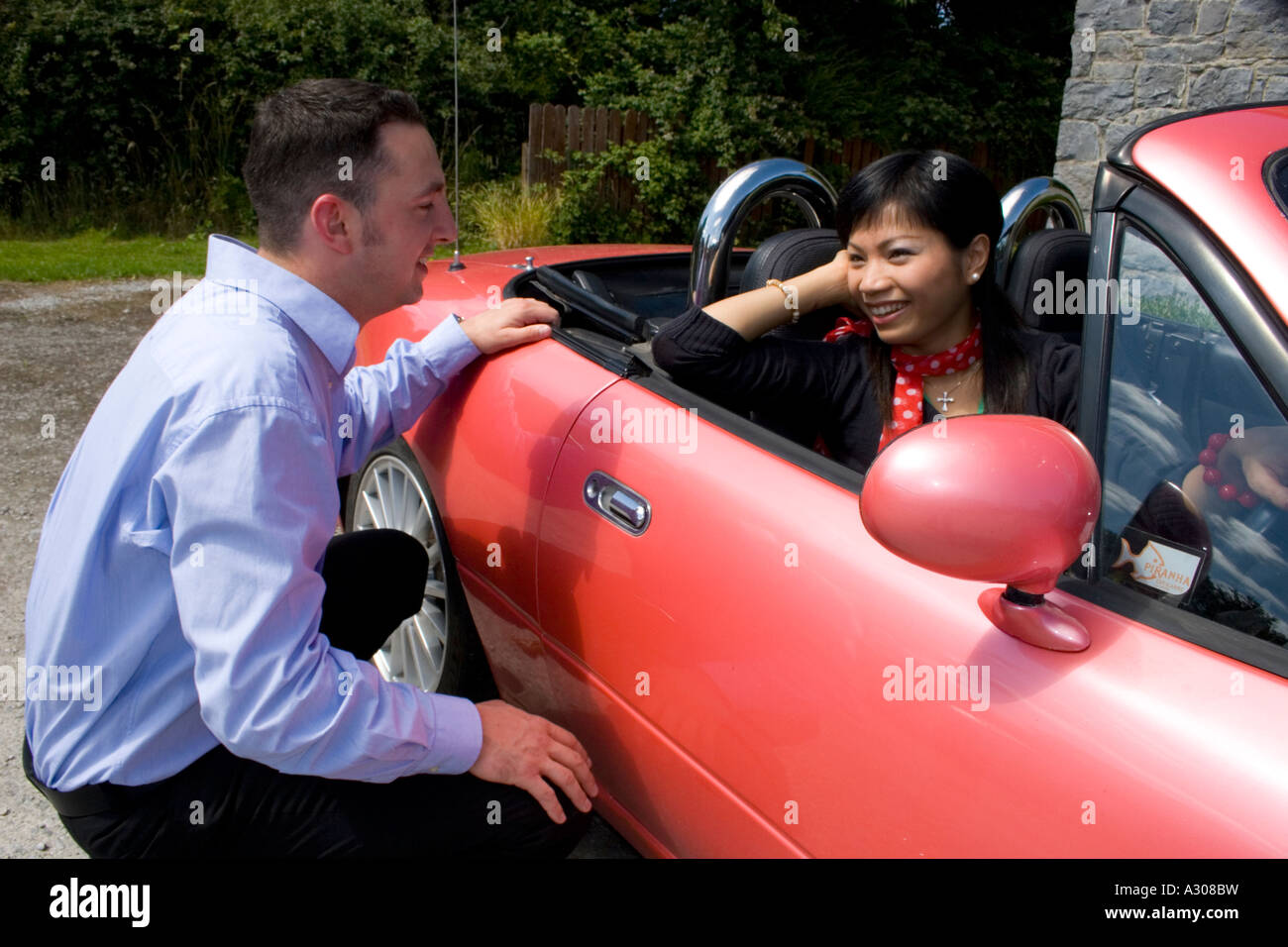 Chinese woman and caucasian man smiling Stock Photo