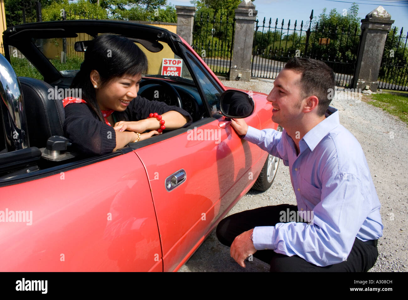 Chinese woman and caucasian man talking outdoors Stock Photo