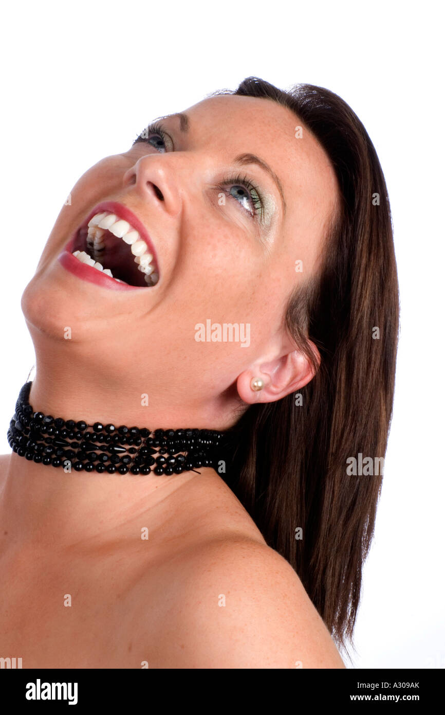 Side profile of a laughing Irish woman Stock Photo