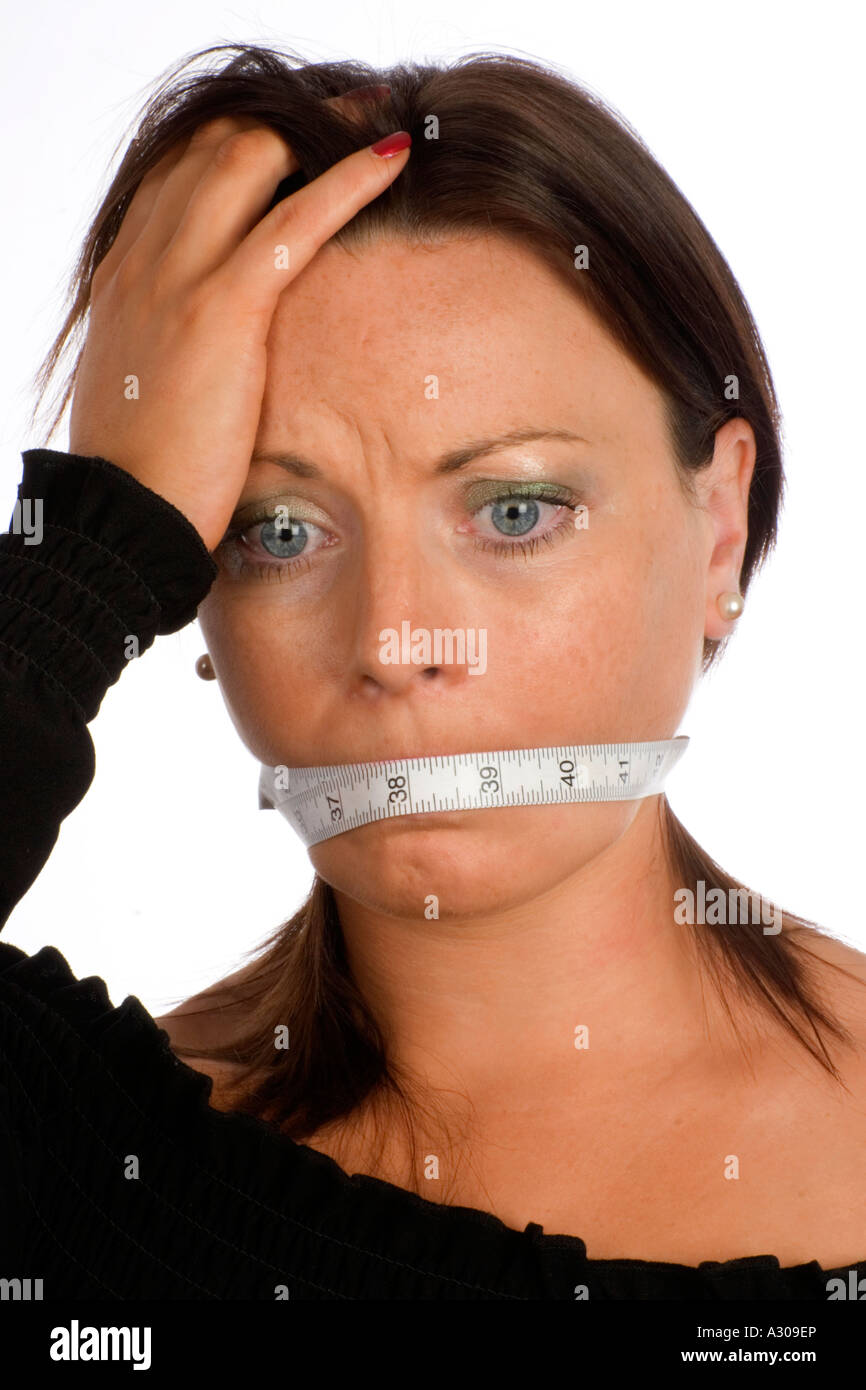 close up view of young woman mouth gagged with tape Stock Photo - Alamy
