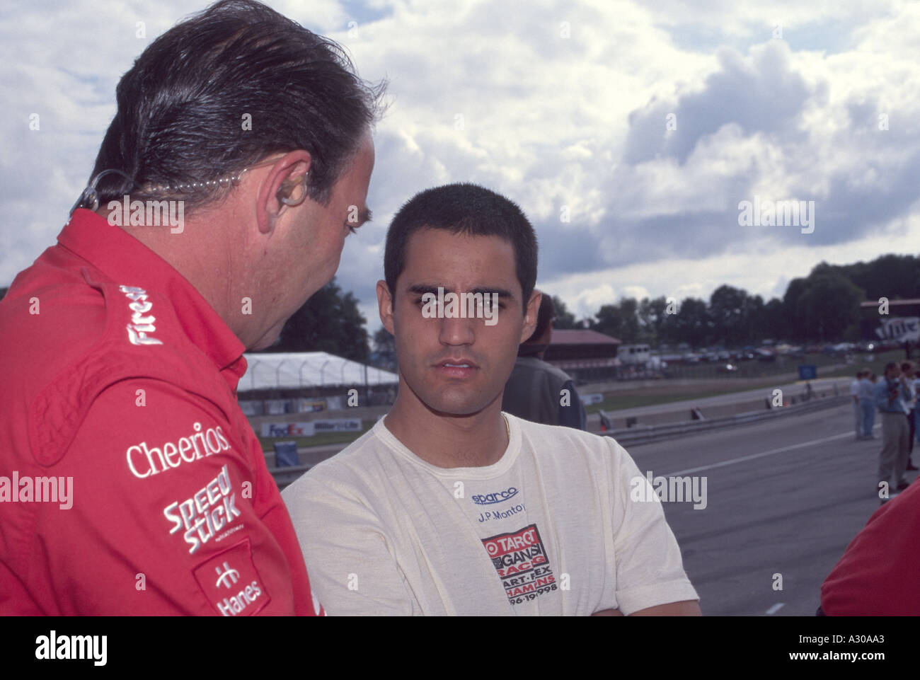 Juan Pablo Montoya talks to a team member at Mid Ohio 1999 Stock Photo