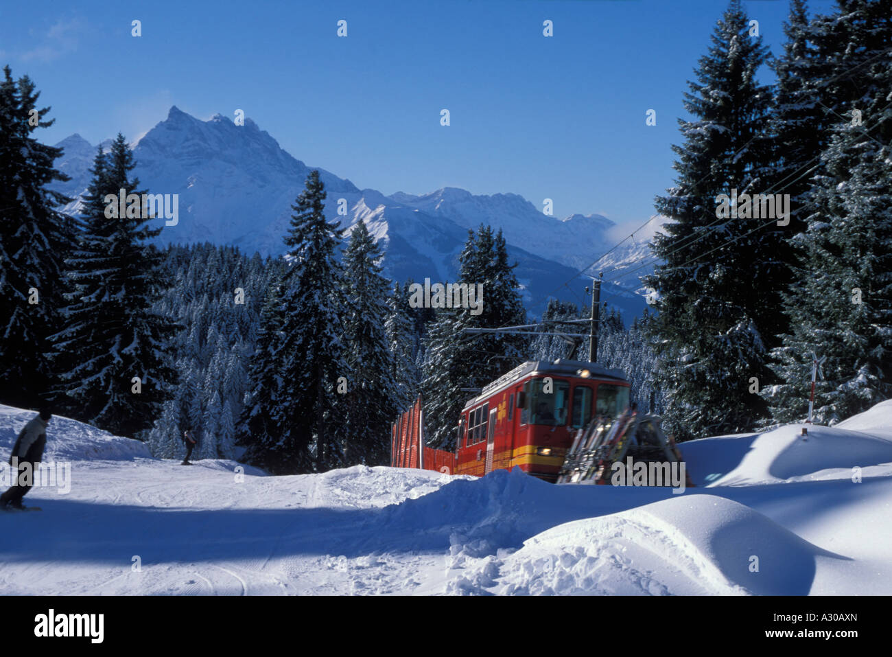 Ski train BVB near Villars Vaud Switzerland with the Dents du Midi mountain in the background Stock Photo