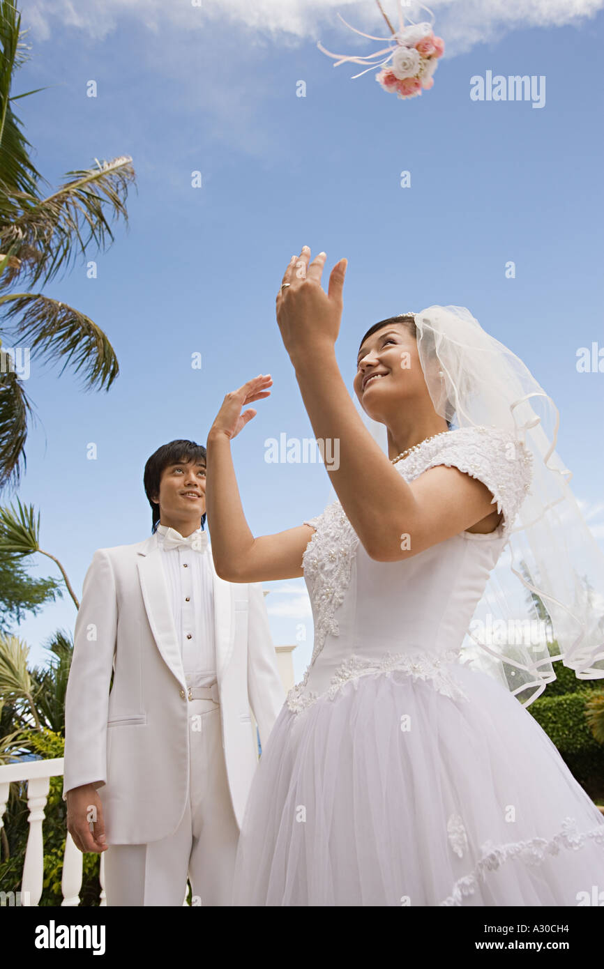 Bride throwing bouquet Stock Photo Alamy