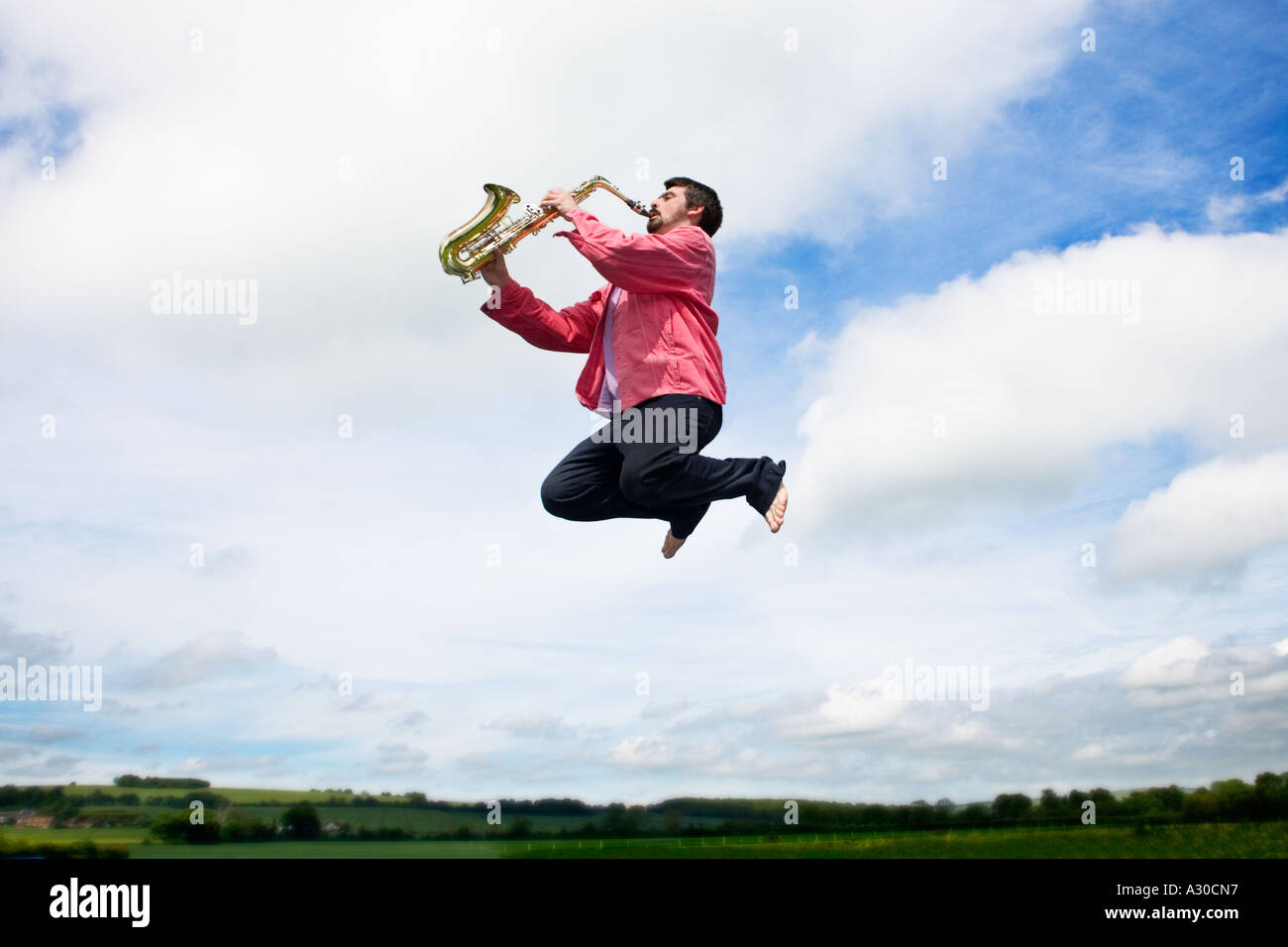 Man holding saxophone hires stock photography and images Alamy