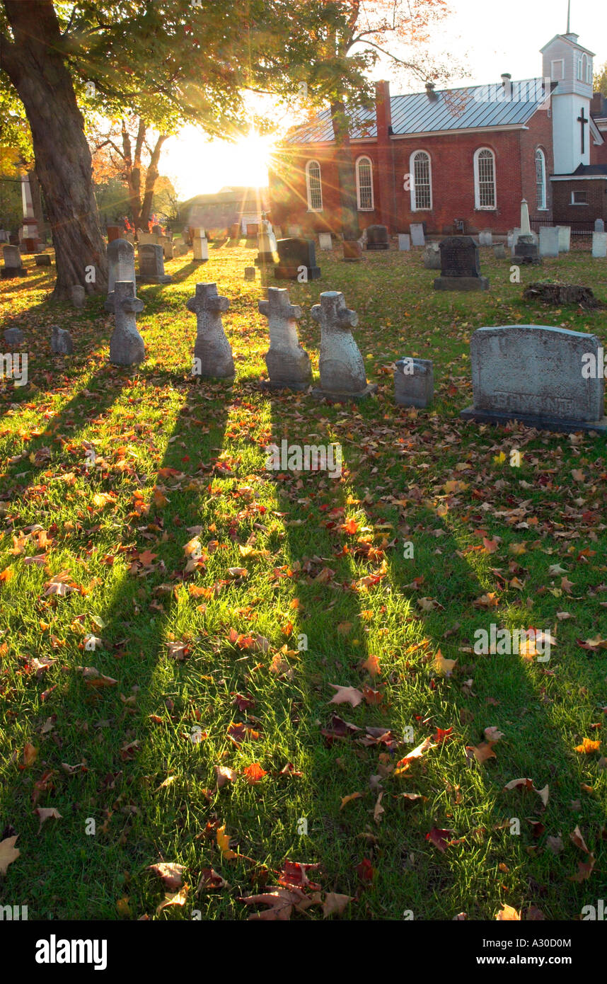 Strong shadows from four cross shaped gravestones in a graveyard in Farnham Estrie Quebec Stock Photo