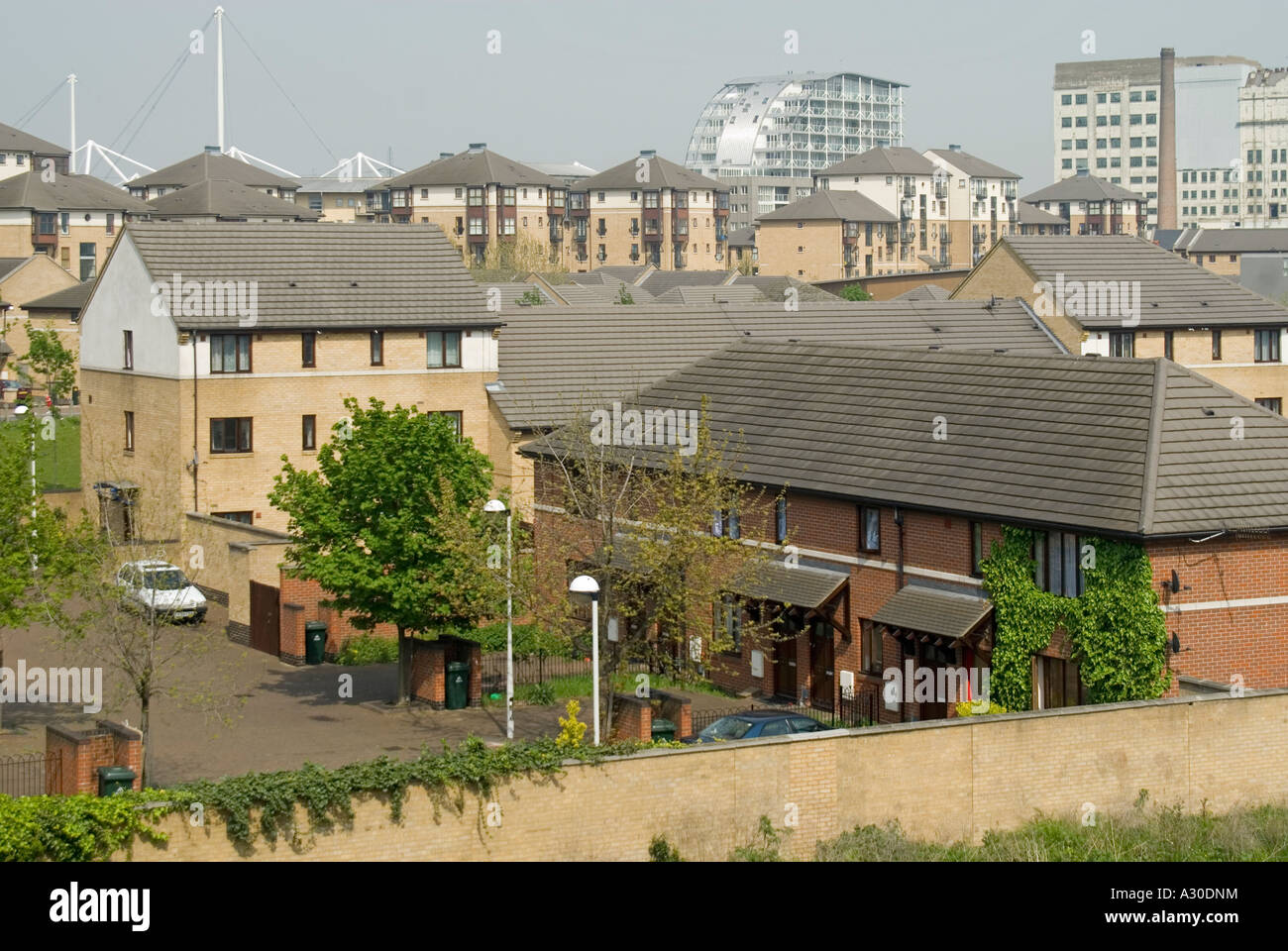 Silvertown modern housing built on waste industrial land adjacent to redundant Royal Albert Dock Excel just visible beyond Stock Photo
