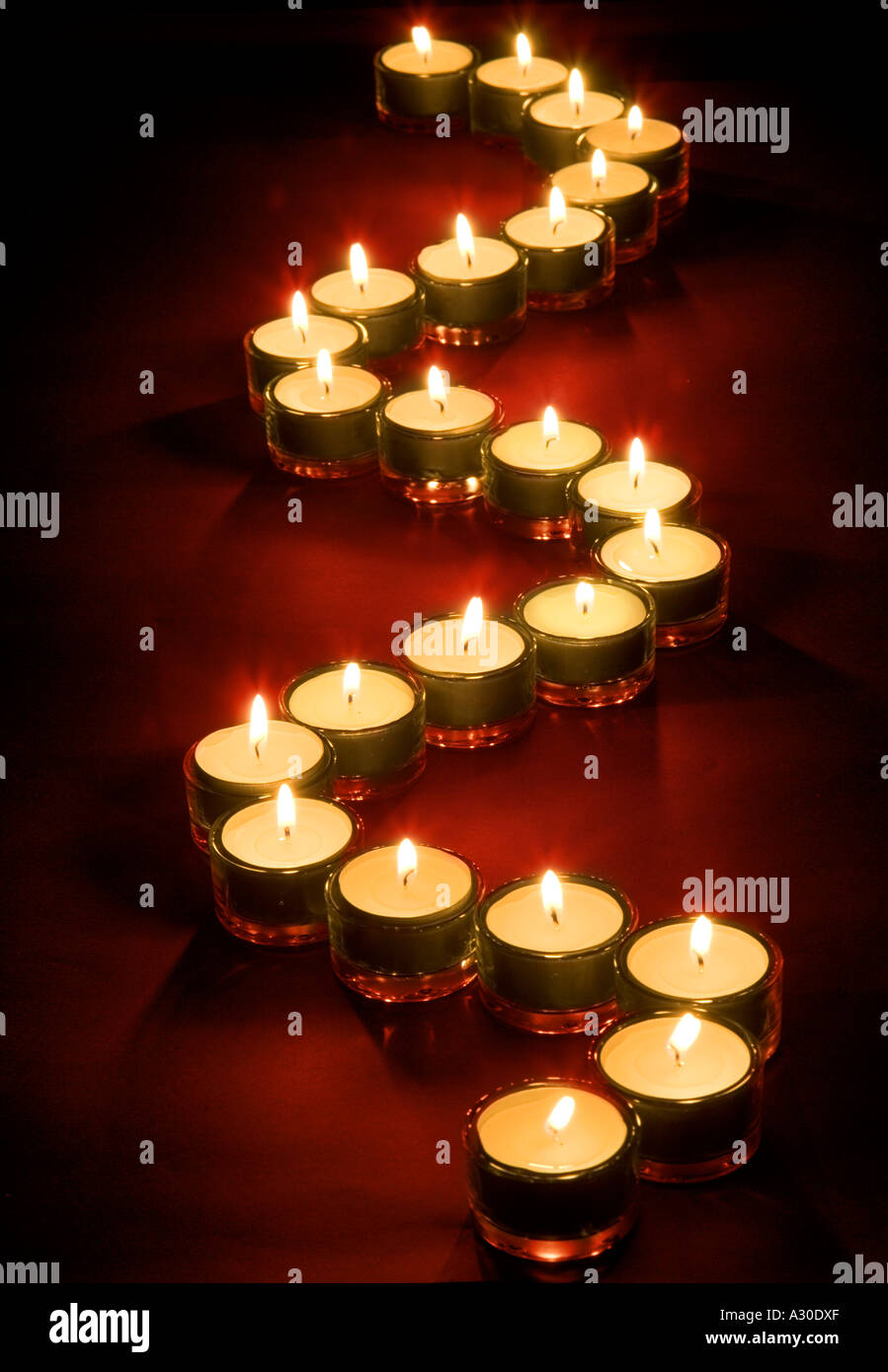 Line of lit candles Stock Photo Alamy