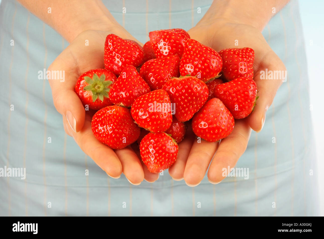 HANDFUL OF FRESH STRAWBERRIES Stock Photo - Alamy