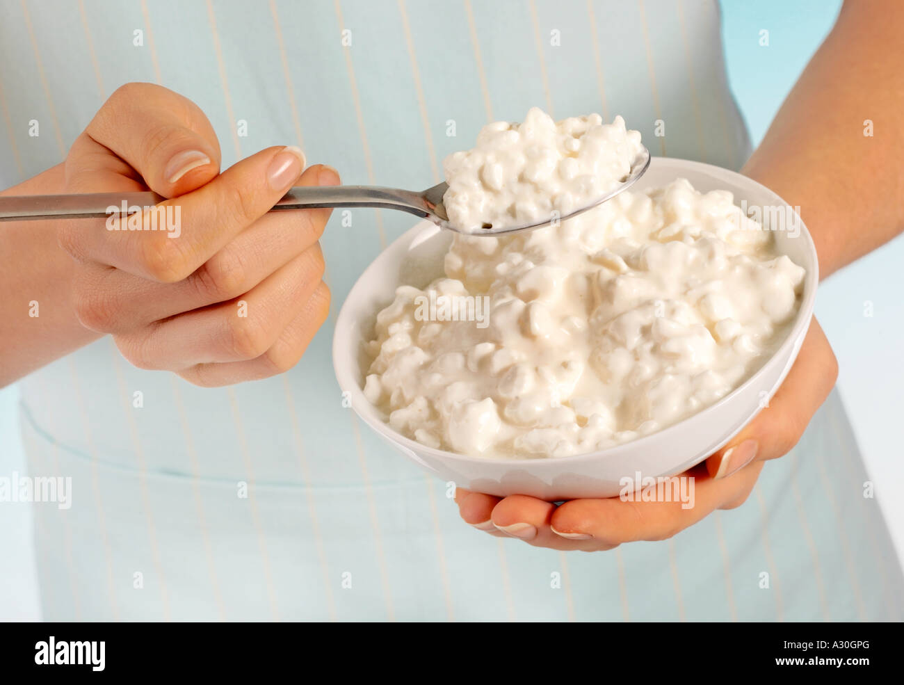 WOMAN EATING COTTAGE CHEESE Stock Photo Alamy