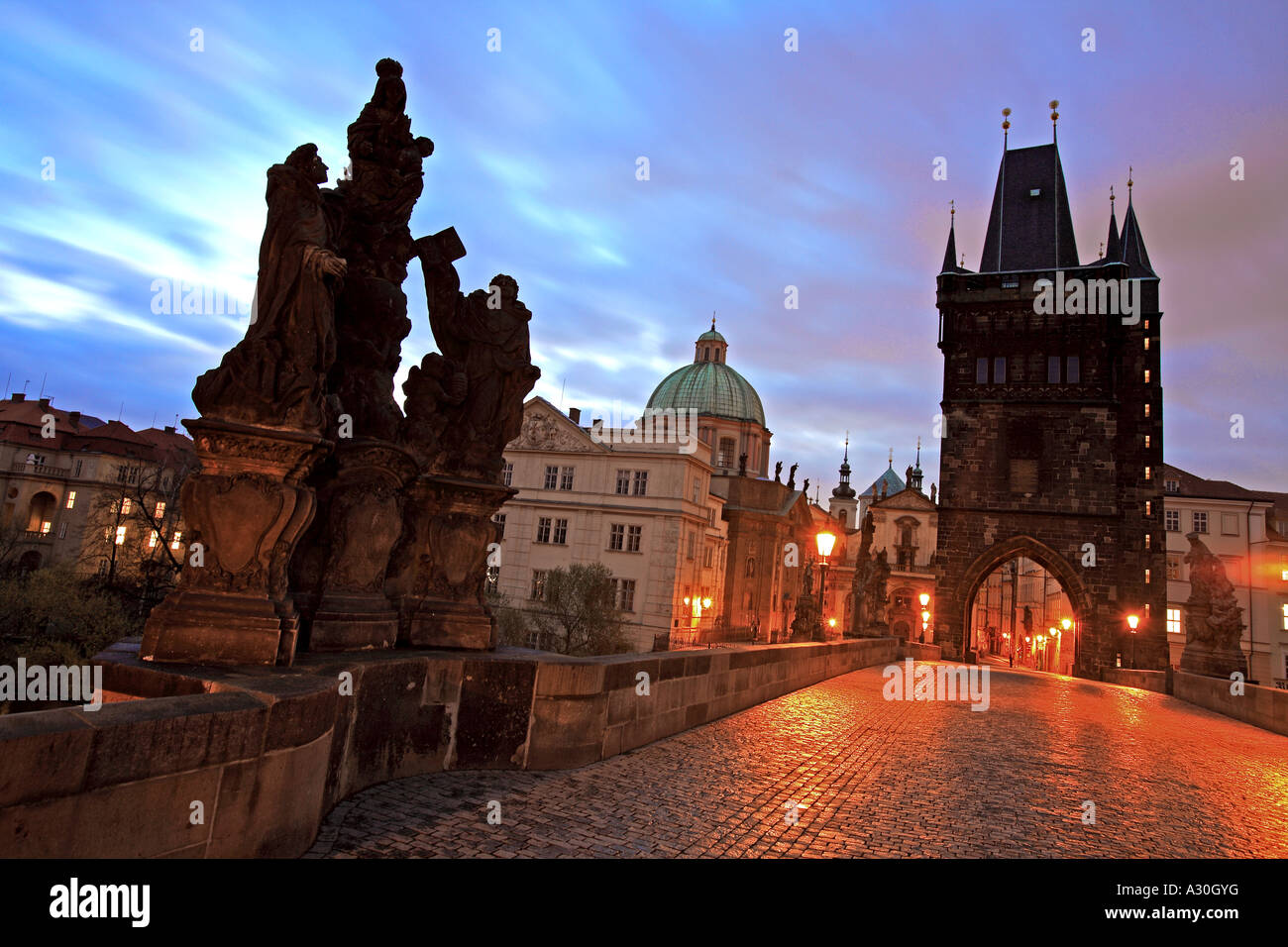 Sunrise At The Old Town Bridge Tower And Statue Of t Dominic And St Thomas Aquinas On The Charles Bridge Prague Czech Republic Stock Photo