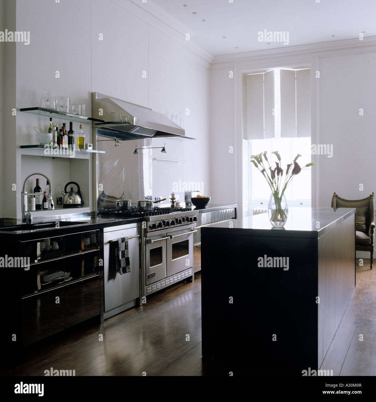 Granite Island Unit And Shutters In Modern Kitchen With Walnut