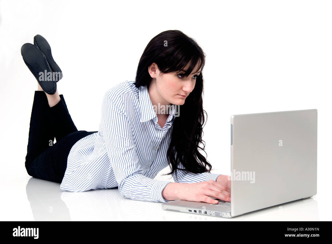 young woman laying on the floor using a laptop computer Stock Photo - Alamy