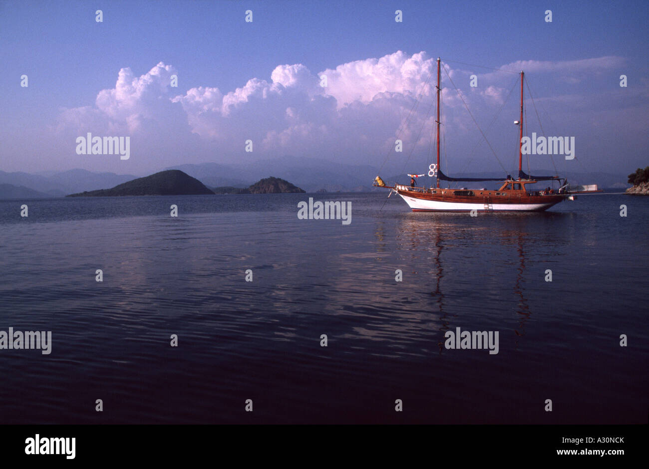 Moored wooden tour boat on a Blue Cruise Fethiye Bay South Turkey Stock Photo