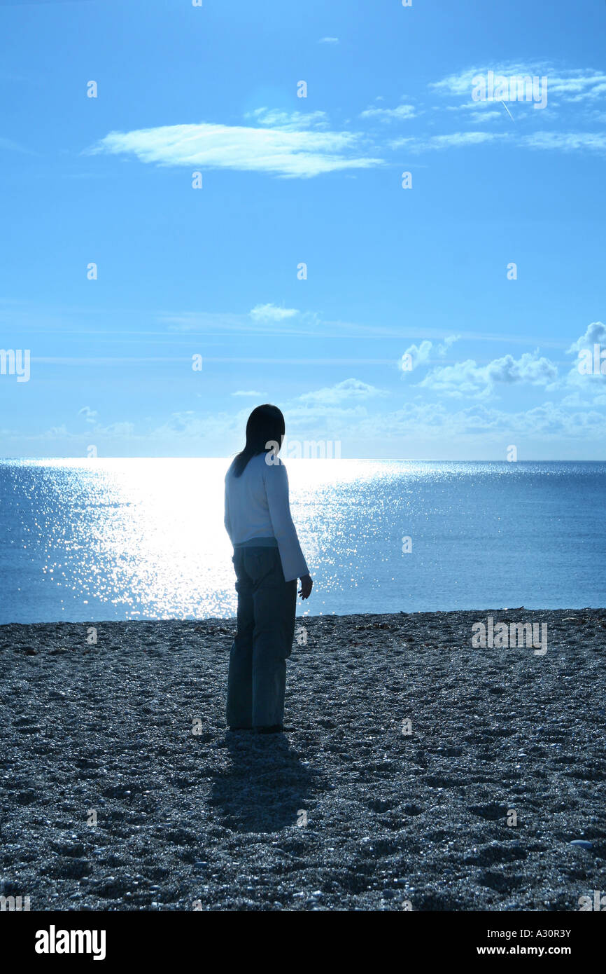 young woman stood on the beach Stock Photo - Alamy