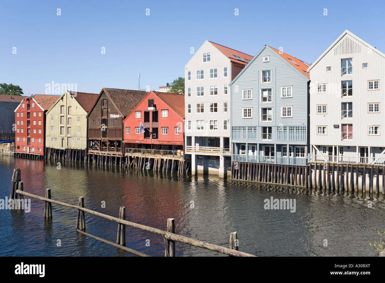 Buildings on stilts along the Nidelva riverfront at Trondheim Norway ... - Norway Riverfront High-End Apartments