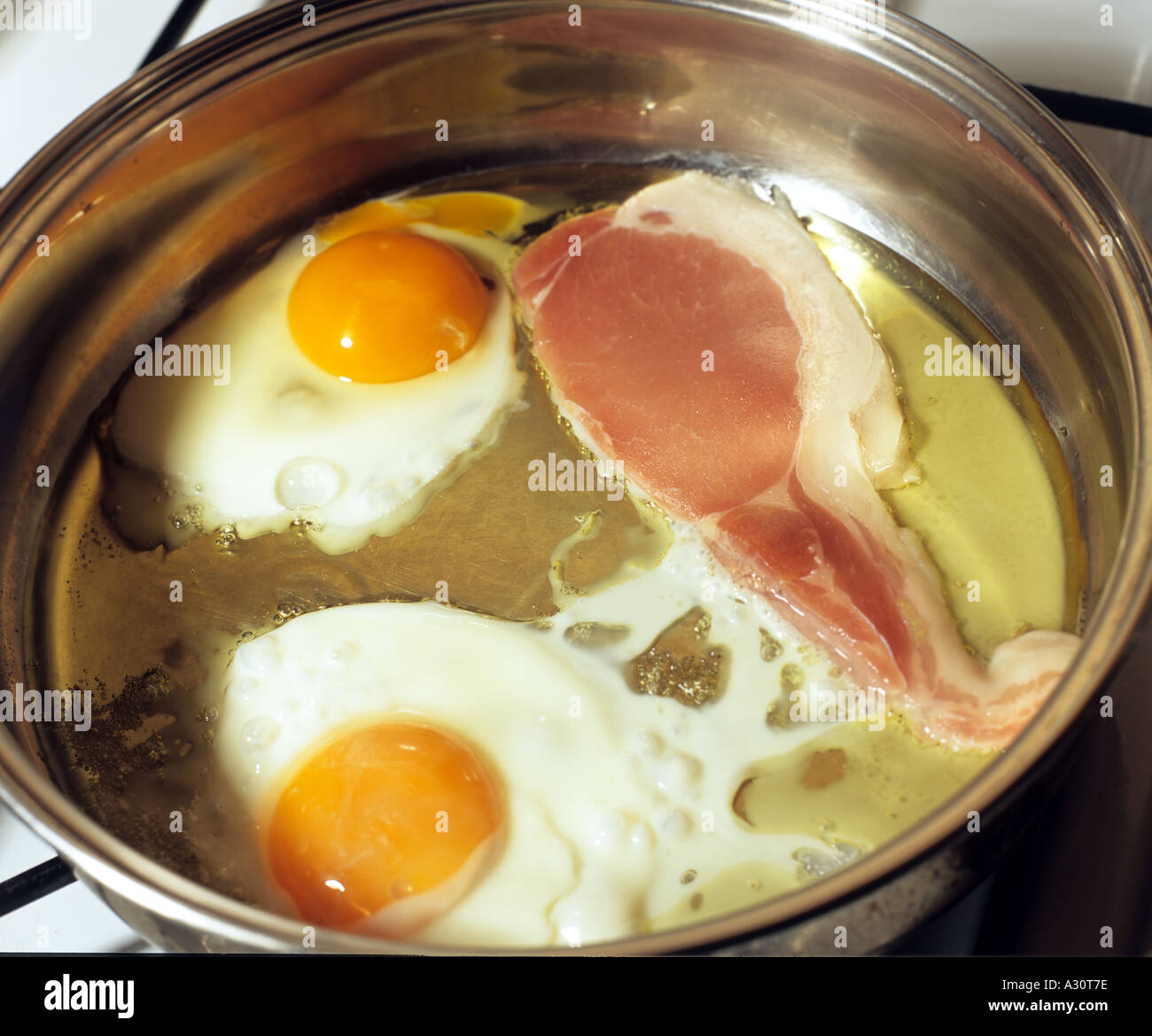 Eggs and Bacon Frying Stock Photo - Alamy