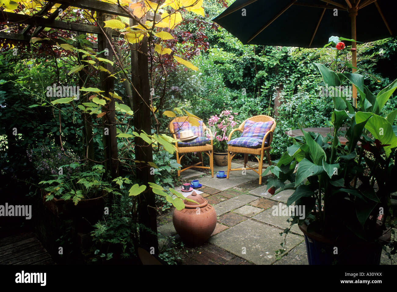Patio garden small wicker chairs Stock Photo