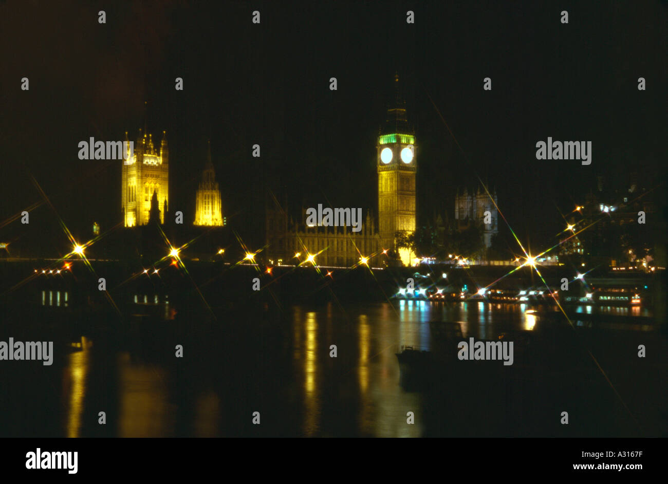 View of Westminster at night with Big Ben and Westminster Bridge and Houses of Parliament London England Stock Photo