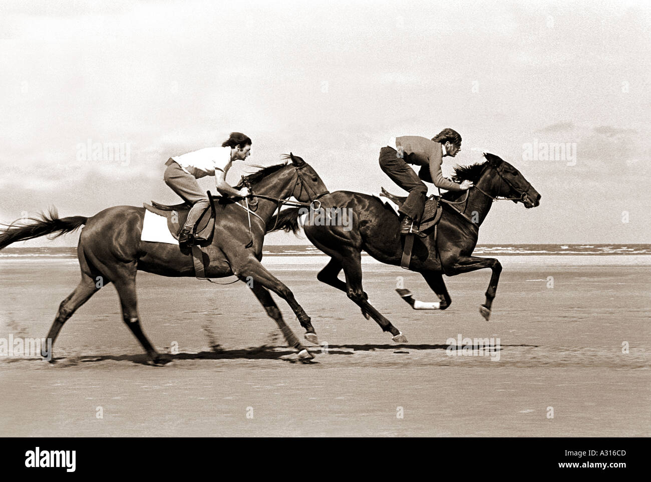 Vintage 1974 UK Southport Racehorses training on the beach  Stock Photo