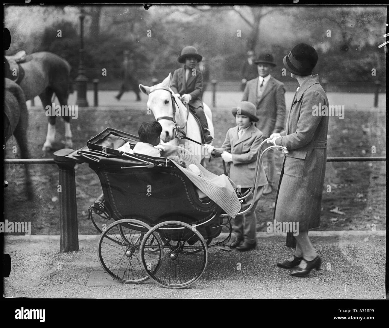 Children with a nanny Black and White Stock Photos & Images - Alamy