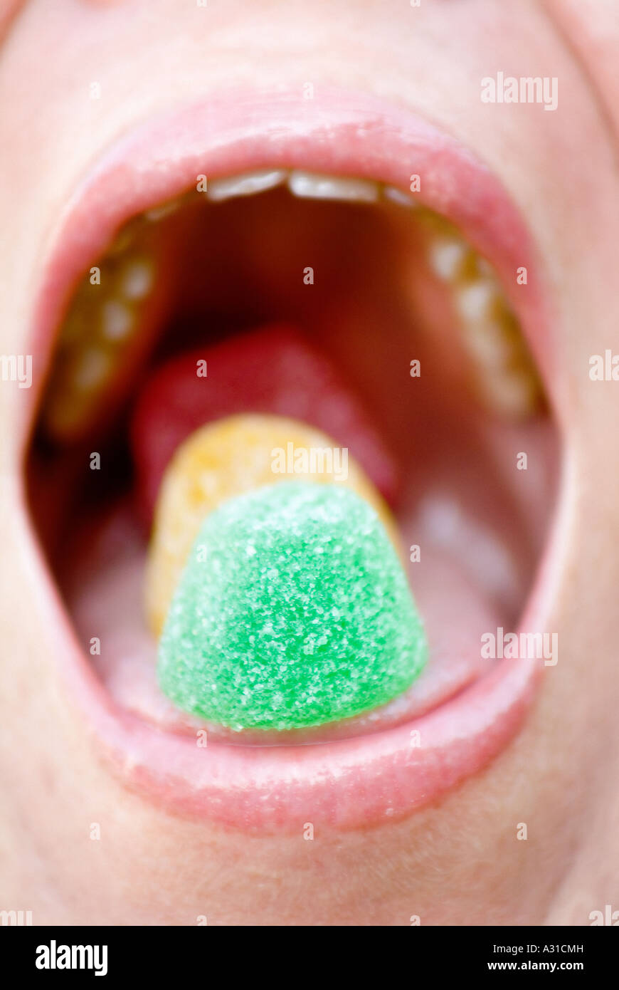 Close up of mouth with sugarcoats Stock Photo