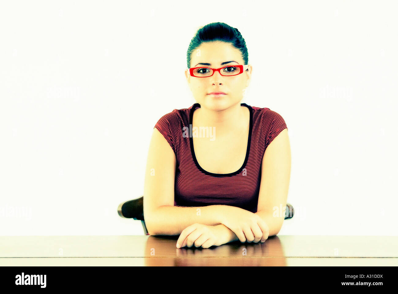 Young girl wearing glasses looking at camera Stock Photo