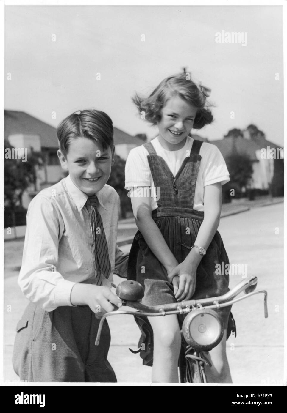 Boy Girl With Bicycle Stock Photo