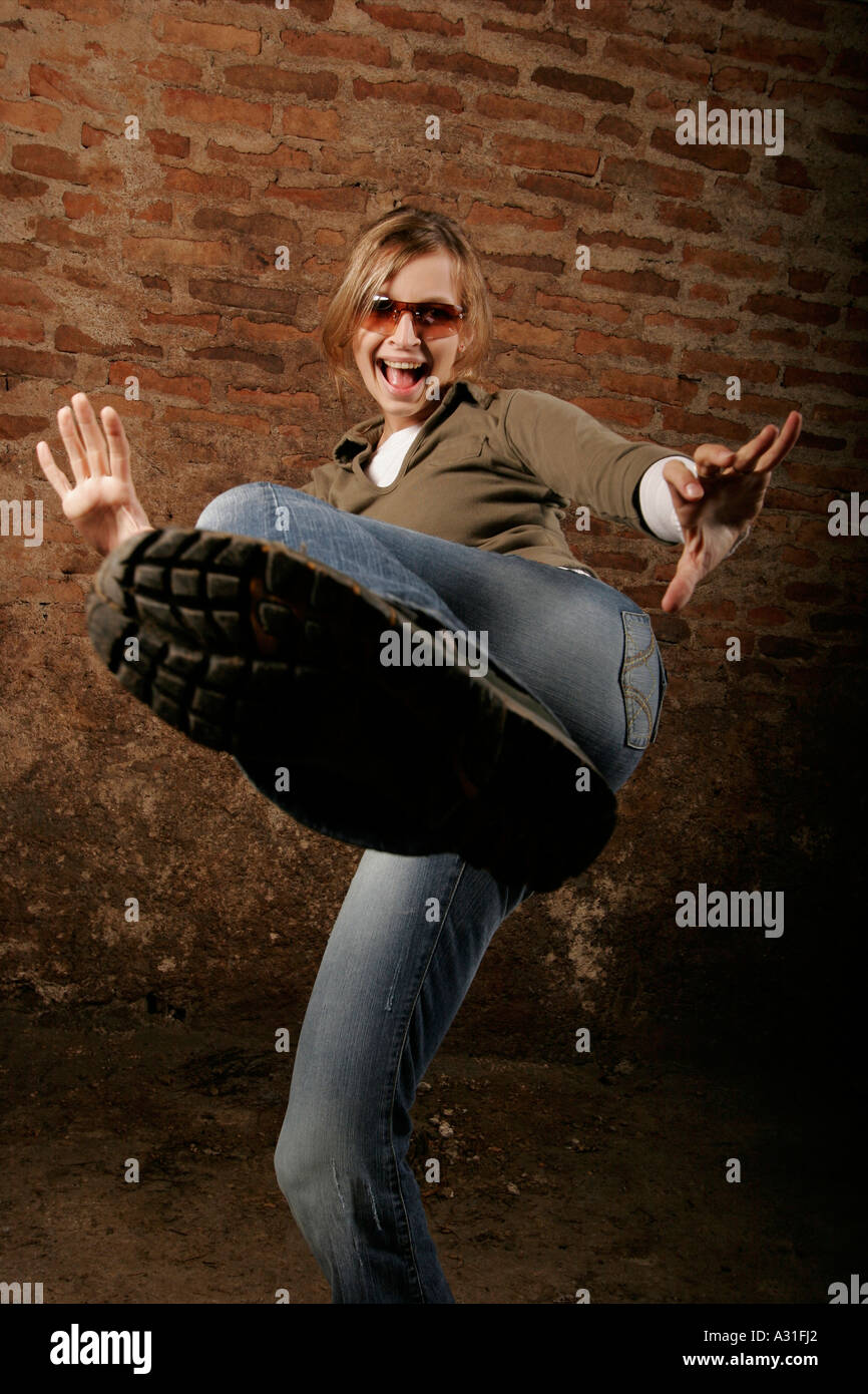 Young woman jumping showing feet low angle view Stock Photo