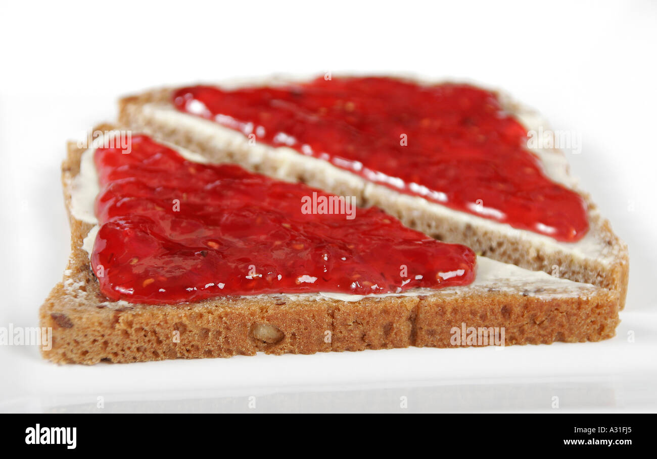 Slices of brown bread with jam close up Stock Photo