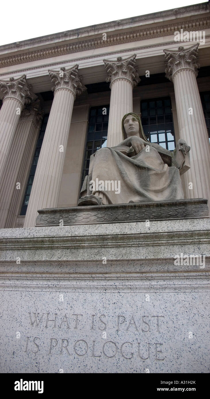 Looking up at stone statue outside National Archive 'WHAT IS PAST IS PROLOGUE' Stock Photo