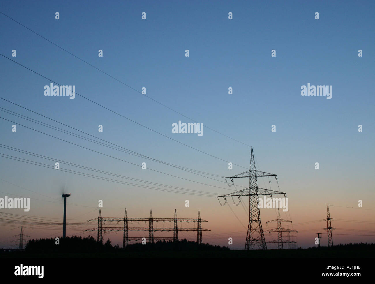 Electricity pylon and power lines sunset Stock Photo
