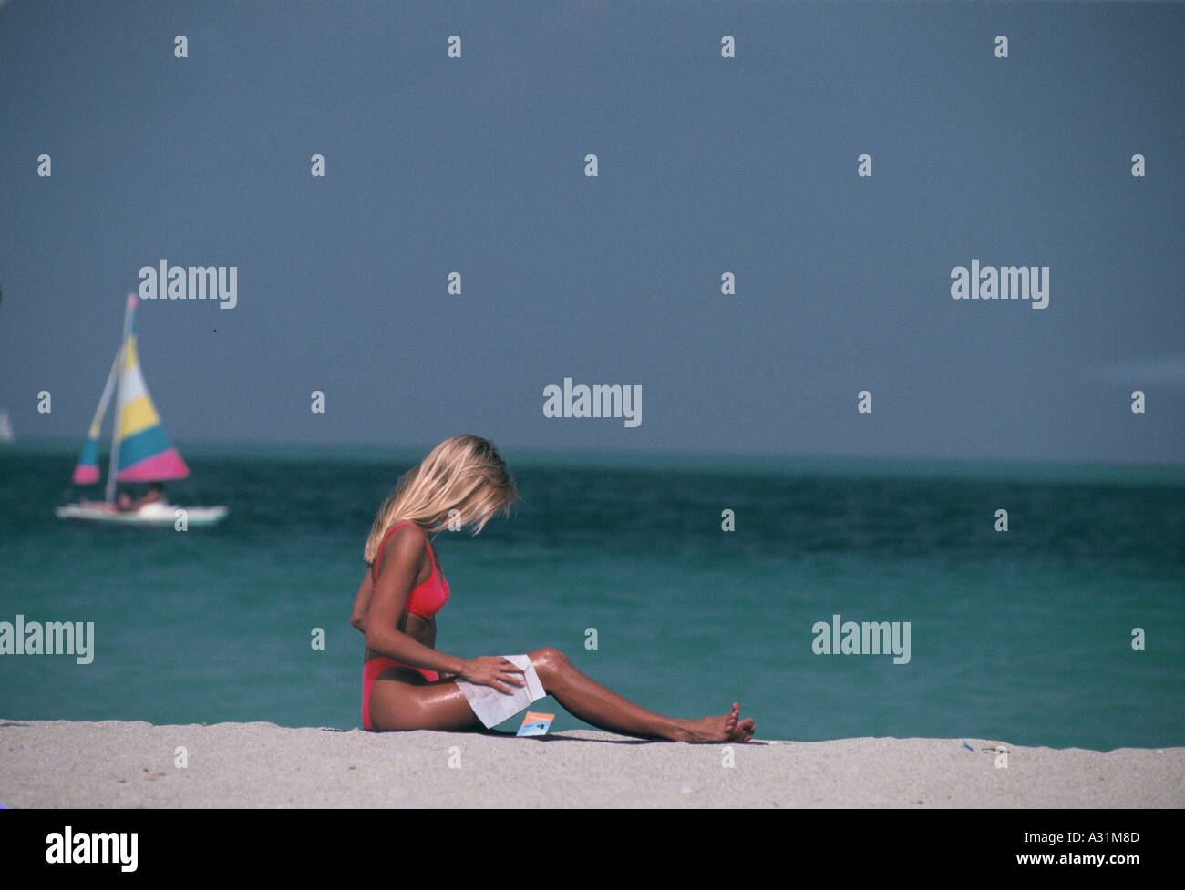 Woman sunbathing on Miami beach, USA Stock Photo