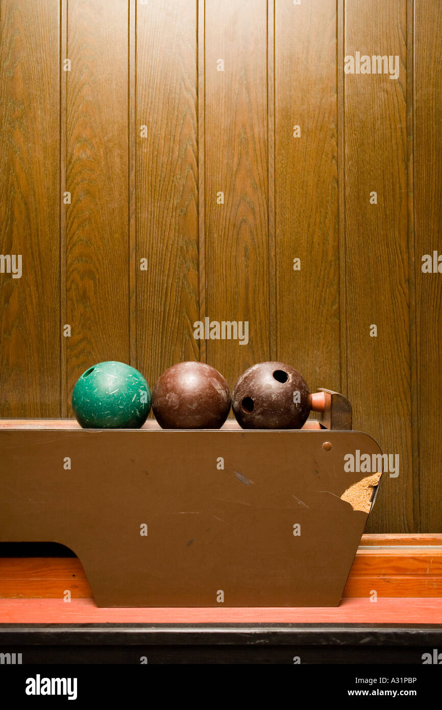 Three bowling balls in bowling alley Stock Photo