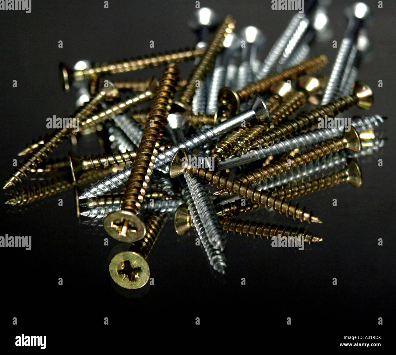 A pile of gold and silver screws Stock Photo Alamy