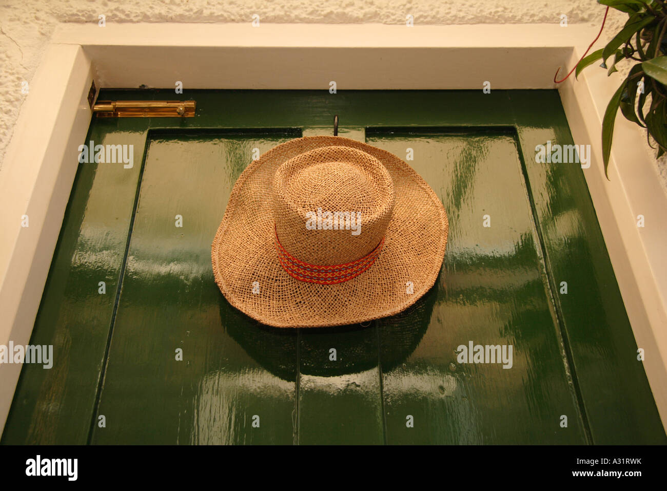 Old straw hat hanging hi-res stock photography and images - Alamy