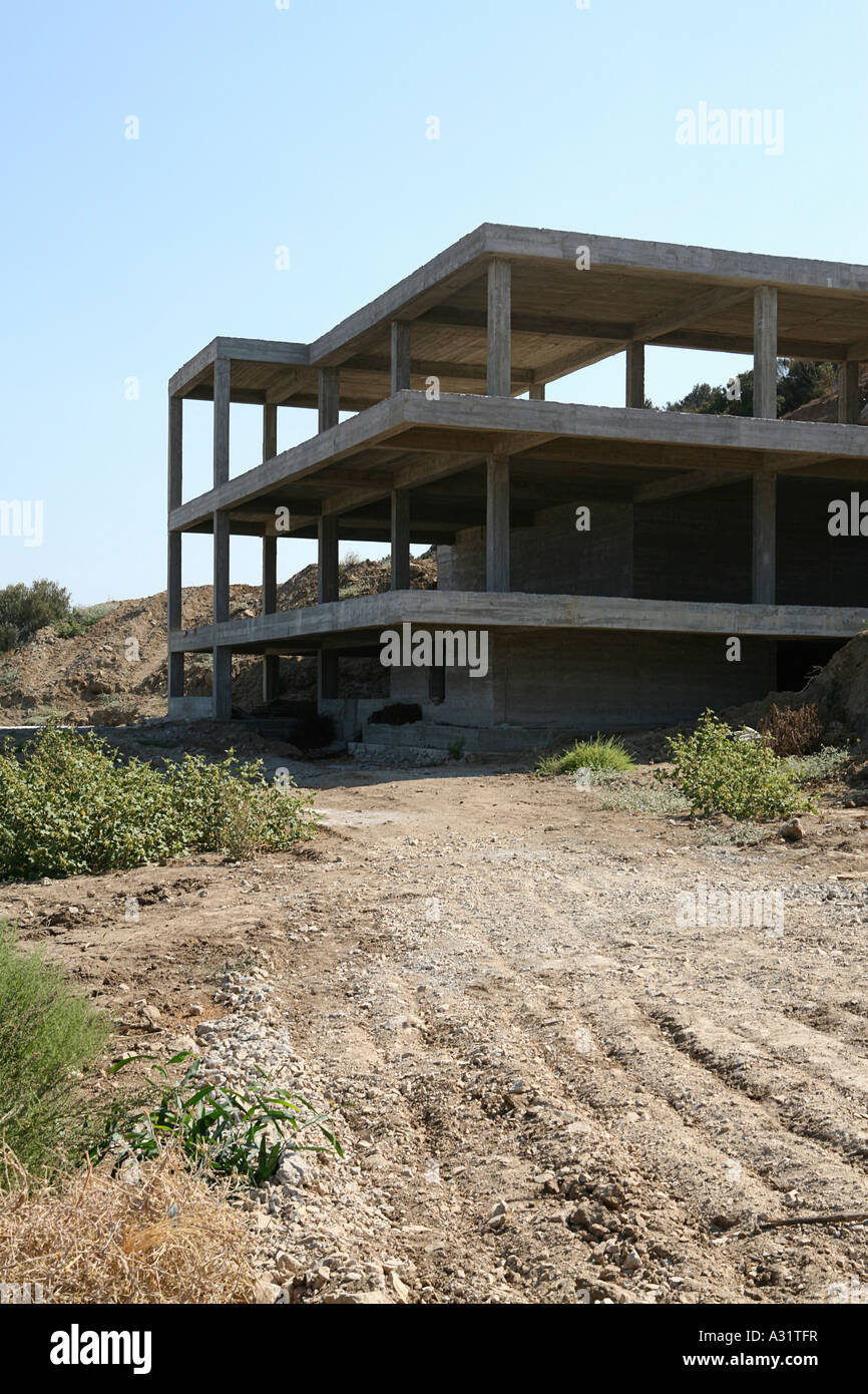 Concrete construction frame of building on hillside Stock Photo - Alamy