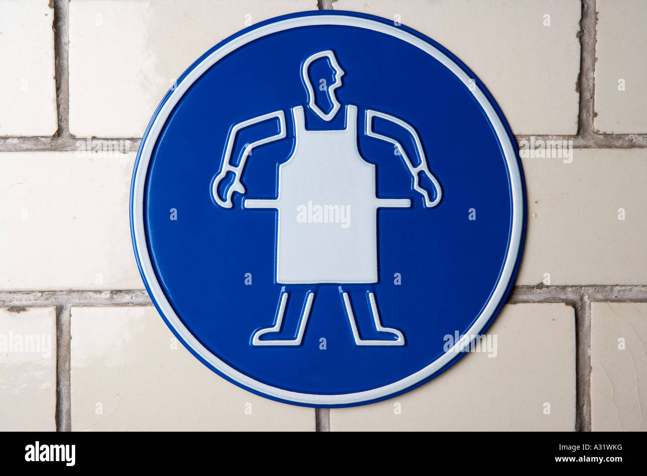 Wear apron caution sign Stock Photo Alamy