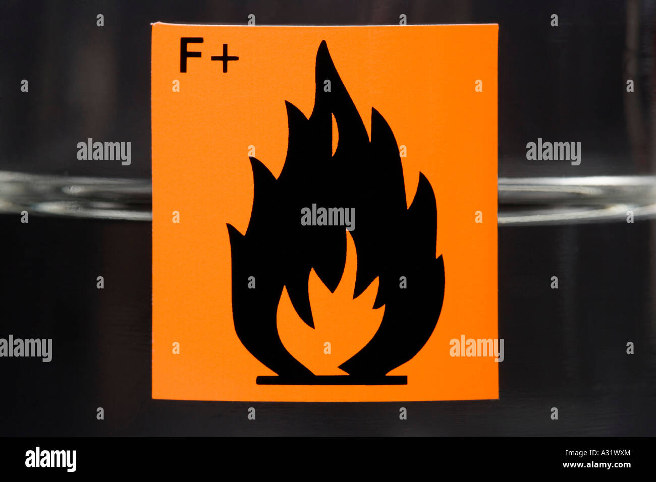 Highly flammable label on glass flask containing liquid Stock Photo Alamy