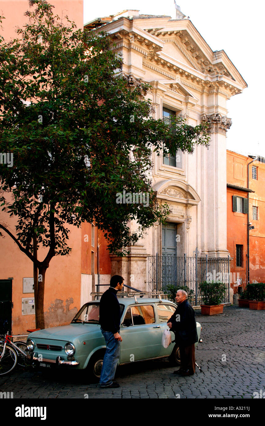 A Fiat 850 parked in the Trastevere area of Rome Italy Stock Photo
